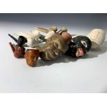 Miscellaneous clay pipes of various colours.