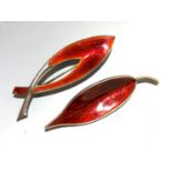 Two Danish silver and red enamel brooches, one marked Meka Sterling Denmark, boxed.