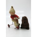Vintage doll with tricycle and a toy Bongo dog (2). (Dimensions: Height 31cm and 19cm