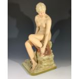 A Royal Dux type porcelain figure of a seated female nude, impressed numbers 1360 to base. (