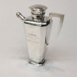 A silver cocktail shaker.