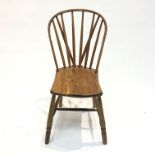 A primitive ash and beech hoop back windsor chair, late 19th century.