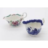 A Bow polychrome painted sauce boat, 1754, and a blue and white glazed sauce boat, 1769 (2). (