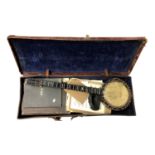 A mother of pearl inlaid rosewood banjo, stamped 'J.E.Brewster Maker London', impressed no. 1156,