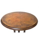 A Victorian walnut occasional table, the circular top with figured veneer and inlay. (Dimensions: