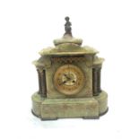 A French onyx mantel clock, late 19th century, the architectural case surmounted by a gilt cherub,