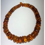 An amber necklace consisting of graduated disc shaped beads.