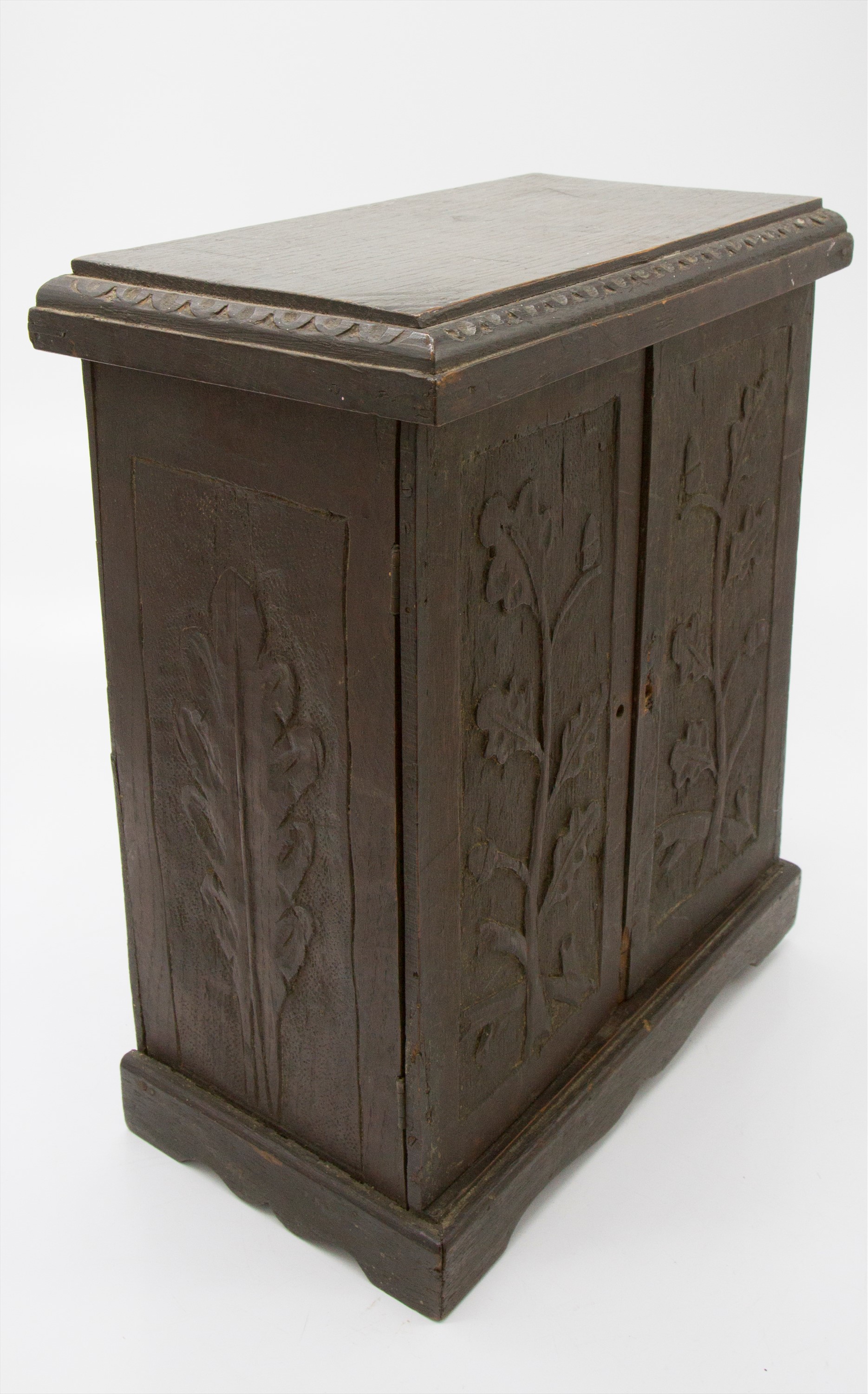 An Arts and Crafts period oak table cabinet, the two doors carved with oak leaves and acorns, - Image 3 of 3