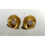 A pair of contemporary diamond set gold disc earrings. (Qty: 1)