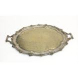 A Mappin & Webb silver plated twin handled tray with pierced border. (Dimensions: Width 80cm.) (Qty: