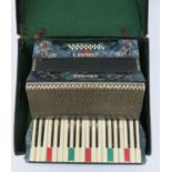 A Hohner 'Carmen II' piano accordion, cased.