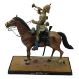 A carved and painted mounted figure, 'Bugler, 10th Hussars, 1880', the base signed Jones, together