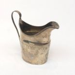 An engraved Georgian silver helmet cream jug, 3.2oz.