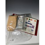A Great Britain mint and used stamp album, together with a bag of G.B. presentation packs and F.D.