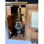 A Seibert Wetzlar microscope with triple objectives, cased. (Dimensions: Height of microscope