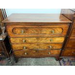 A mahogany secretaire chest, early 19th century, the top drawer opening to reveal a red leather