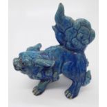 A Japanese blue glazed pottery shi shi dog, (Dimensions: Height 20cm, width 16cm.)(Height 20cm,