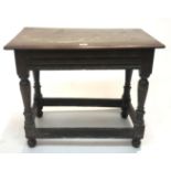 An oak side table, early 18th century, the rectangular moulded top on turned legs joined by