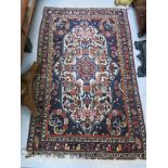 A Bidjar rug, West Persia, the indigo field with a large ivory medallion with flowering vines and