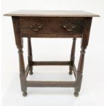A George III oak side table, with a single frieze drawer, on turned and block legs joined by