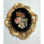 A Victorian brooch set with an Italian micromosaic floral panel.