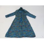 A Peony Brand (Shanghai, China) blue silk coat with machine embroidered decoration.