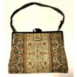 Finely embroidered black and ivory silk evening clutch purse with black enamelled gilt frame and