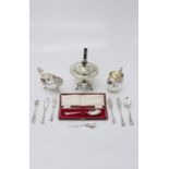 A silver plated teapot, sauce boat and milk jug, together with a small quantity of cutlery. (Qty: