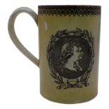 A Georgian pearlware commemorative mug, attributed to Swansea, transfer printed in green with the