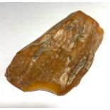 A large piece of amber, 11.2 x 6.5 x 1.5cm, 134.7g.