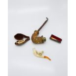 Meerschaum pipes including one mounted with a horse (cased), another mounted by a Setter type dog, a