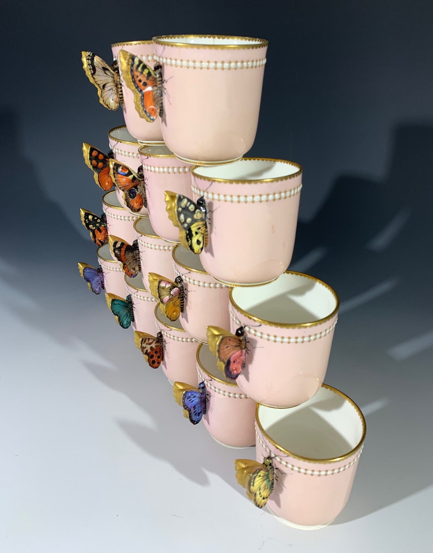 A Royal Worcester coffee service, circa 1875, comprising 15 coffee cans, each with hand painted