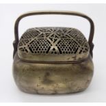 A Chinese brass hand warmer, (Dimensions: Height 9cm x 14cm.)(Height 9cm x 14cm.)Condition report: