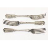 A pair of Georgian silver fiddle pattern table forks together with an early Victorian silver