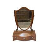 A mahogany dressing table mirror, 19th century, with a shield shaped plate above a serpentine base