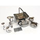 A silver plated epergne, a three piece tea service, a basket with swing handle and a cigarette