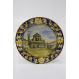 A 19th century Italian Majolica plate, painted with a view of Piazza Santa Maria Novella within a