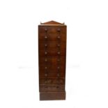 A tall mahogany chest of drawers, circa 1900, with eight drawers on a plinth base. (Dimensions: