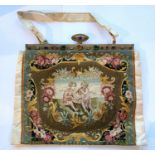 Satin evening purse with ornately embroidered panel in rococco style and gilt frame set with paste