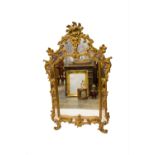 A George III style gilt framed wall mirror. (Dimensions: Height 139cm, width 79cm.)(Height 139cm,