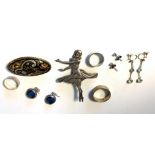 Silver dancer, reindeer gilt brooch, two silver rings etc.