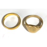 A 18 ct gold band 3.3 gm and a gold signet ring 5.3 gm.