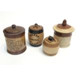 A Doulton Lambeth tobacco jar 'America', together with three stoneware tobacco jars.