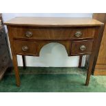 A mahogany bow front sideboard, early 19th century, of small proportions, with three drawers on