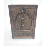 An Indian carved hardwood cupboard, with a pair of arched shape doors. (Dimensions: Height 63cm,