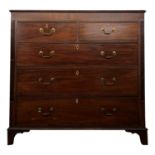 A mahogany chest of drawers, early 19th century, with two short and three long drawers flanked by
