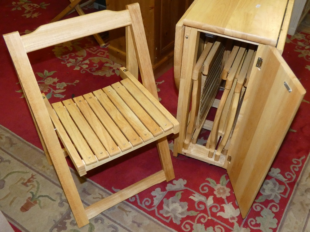 A modern drop leaf dining table incorporating integrated set of four chairs - Image 2 of 2