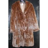 A lady's full length fur coat
