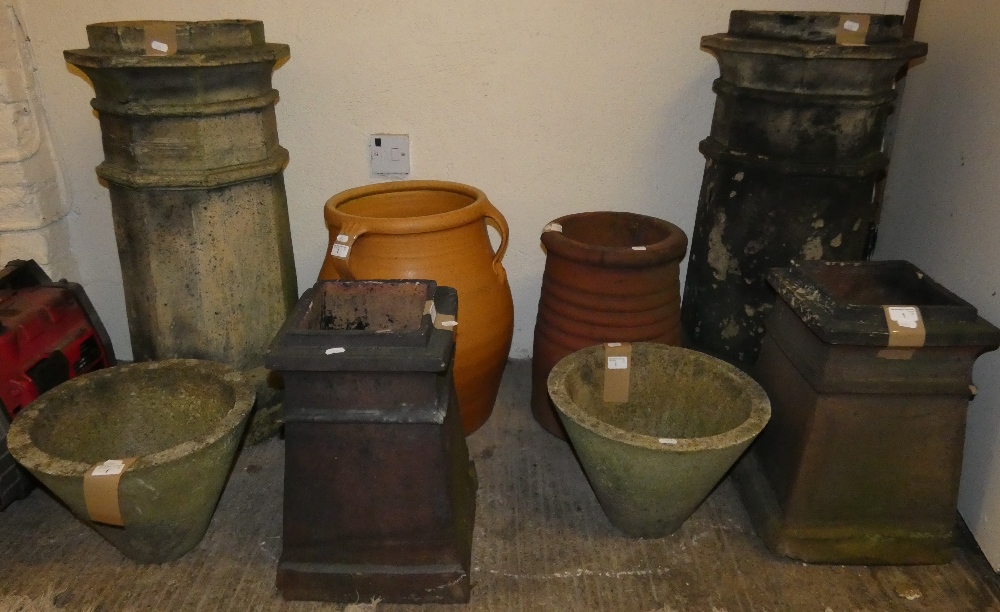 A pair of chimney pots, 83cm tall, together with a pair of small chimney pots and planters (8)