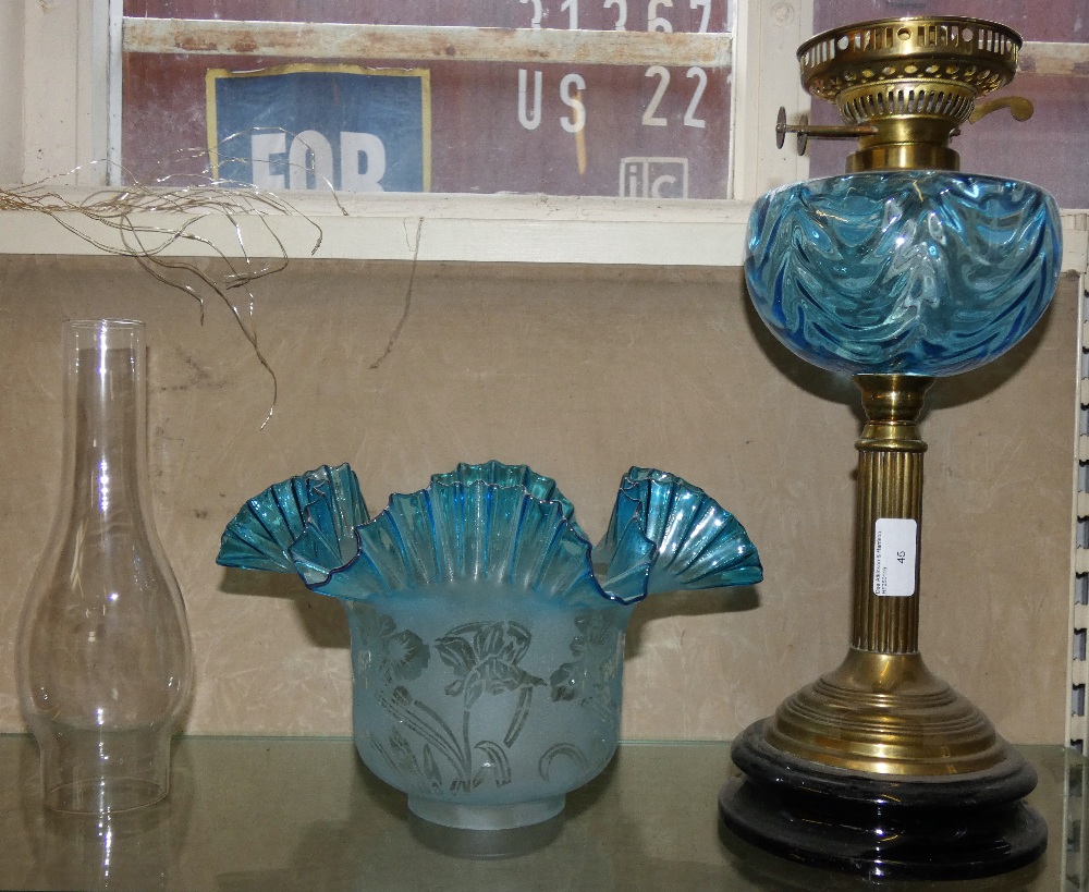 A Victorian style table oil lamp, brass column, moulded blue glass reservoir, duplex burner, blue